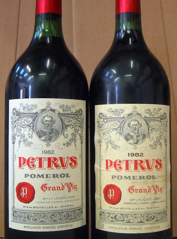 The Antique Wine Company showing a counterfeit magnum (L), which the company spotted and was not sold, and a genuine one (R). Recently fake wine bottles of Jacob's Creek, have been appearing as authorities traced the production coming from China.  (AFP/Getty Image)