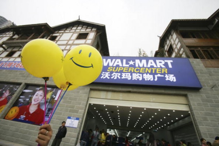 Promotional balloons are held outside Chongqing's second Wal-Mart store, which opened on Nov. 16, 2006 in Chongqing, China.  (China Photos/Getty Images)