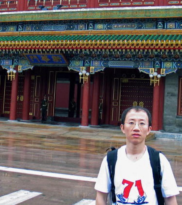 June 2007, Chinese AIDS and pro-democracy activist Hu Jia wears the July 1st protest t'shirt in front of Zhongnanhai, the Chinese leadership compound in Beijing. ( STR/AFP/Getty Images)