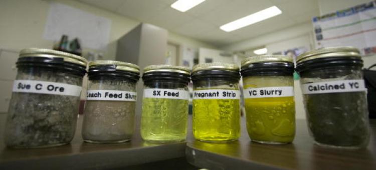 Samples of the six major steps in the uranium refining process produced by uranium mining. (David Boily/AFP/Getty Images)