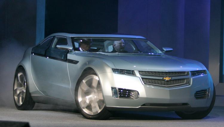 A Chevrolet Volt electric hybrid vehicle drives onto the stage with General Motors Corp. Chairman and CEO Rick Wagoner in the passenger seat. (Ethan Miller/Getty Images)