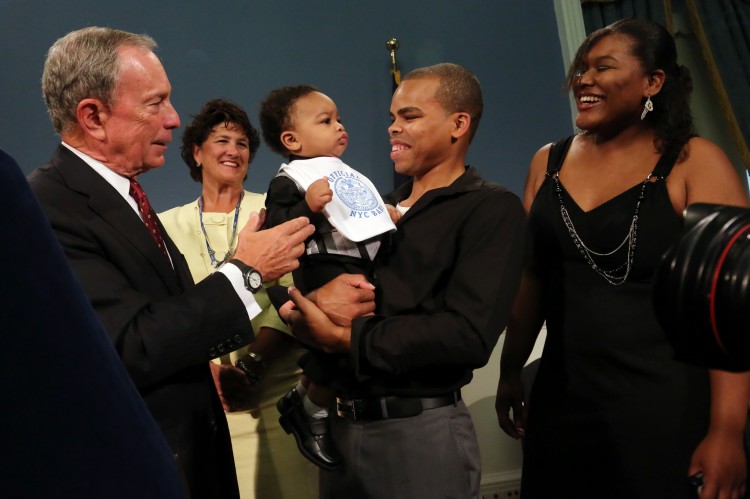 Mayor Michael Bloomberg (L) was joined the parents of Jayden Alexander Marthone while announcing for the third year in a row, Isabella and Jayden were the most popular baby names in New York City. (Spencer T Tucker) 