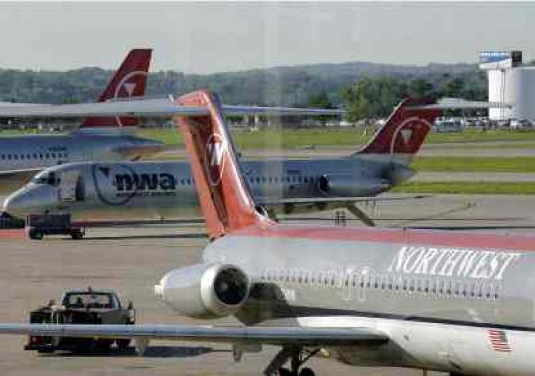 This shows a Northwest airliners jet at Minneapolis airport on August 20, 2005.  (Paul J. Richards/Getty Images)