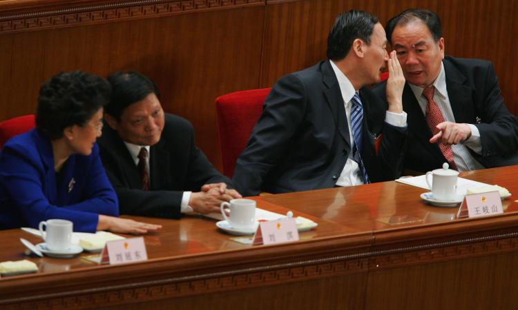 Former Communist Party secretary of Xinjiang Wang Lequan on the right, at the seventh plenary session of the National People's Congress (NPC), in Beijing, March 2008. He stepped down after mass demonstrations recently.  (Feng Li/Getty Images)