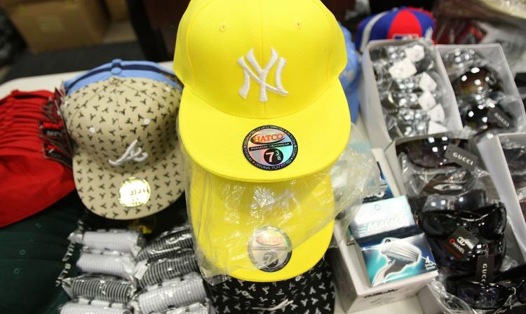 Dealing in counterfeit goods is just one of the many methods used by organized crime groups to rake in the cash. A new report aims to help Canadians understand the various types of threats posed by criminal networks. (Mario Tama/Getty Images)
