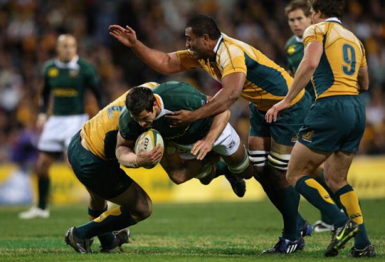 Pierre Spies of the South African Springboks gets tackled by the Australian Wallabies in the third of the Tri-Nations nine-match series. (Cameron Spencer/Getty Images)