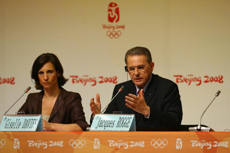 Jacques Rogge, the IOC president and Giselle Davies, the IOC Director of Communications, at a press conference.  (Julian Finney/Getty Images)