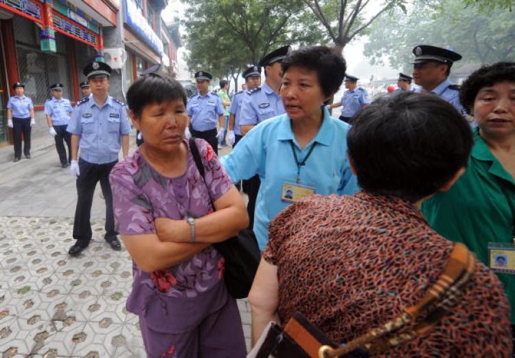 A group of Chinese Christians being turned away by police near the Kuanjie Protestant church in Beijing on 10 August 2008, prior to the arrival of US President George W. Bush.  (Goh Chai Hin/AFP/Getty Images)