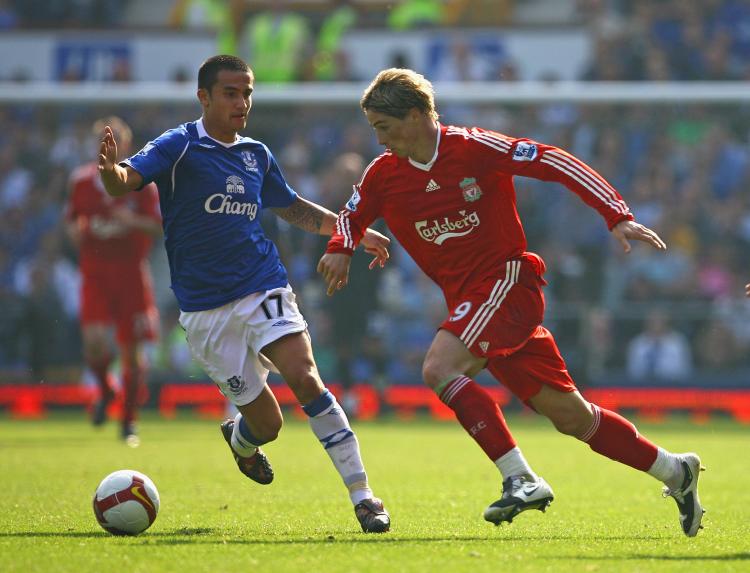 CAHILL CHASING SHADOWS: Fernando Torres of Liverpool (right) beats Tim Cahill of Everton during the Merseyside derby at Goodison Park on Saturday.  (Alex Livesey/Getty Images)