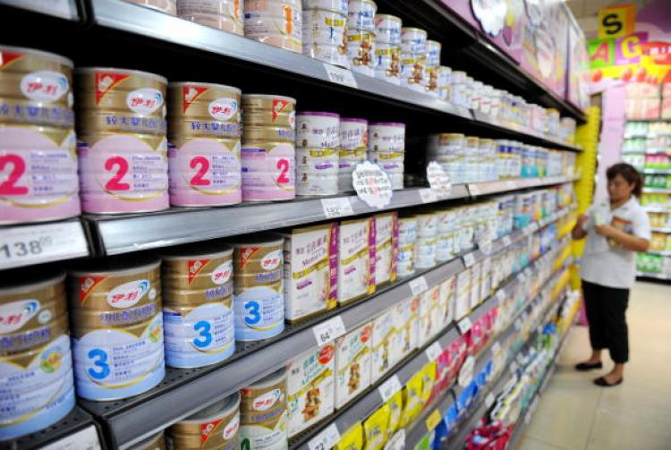 A woman shops for powdered milk at a supermarket on September 28, 2008 in Chengdu of Sichuan Province, China.  (China Photos/Getty Images)