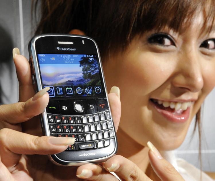 A model displays Canadian electronics maker Research In Motion's BlackBerry Bold smart phone in Tokyo. The new BlackBerry which can use high-speed 3G and IEEEa/b/g wireless LAN network will be launched in Japan early 2009.  (YOSHIKAZU TSUNO/AFP/Getty Images)
