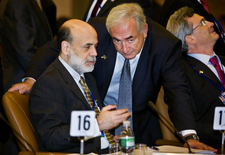 Federal Reserve Chairman Ben Bernanke speaks with Managing Director of IMF, Dominique Strauss before an IMF committee meeting where the hot topic was the world economy. (Stephen Jaffe/IMF via Getty Images)