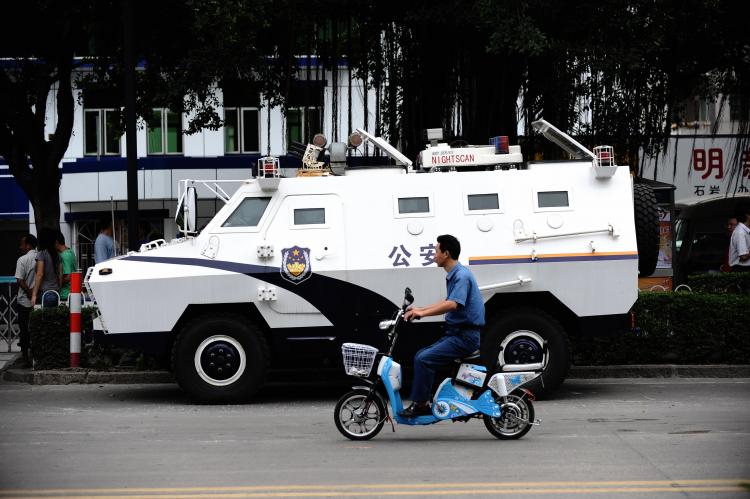 An armoured personel carrier, parked outside a Shenzhen police station that was the center of protests.  (AFP/Getty Images)