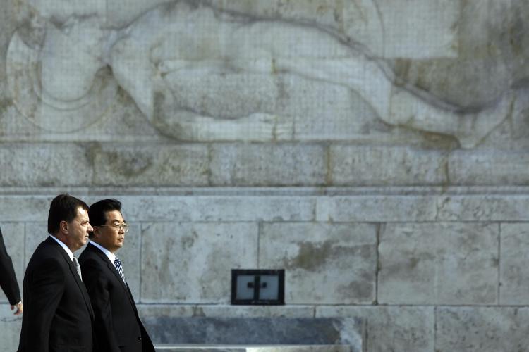 Chinese Communist Party leader Hu Jintao (R) in Athens, 2008, with Greek Deputy Interior Minister Panagiotis Chinofotis.  (Aris Messinis/AFP/Getty Images)