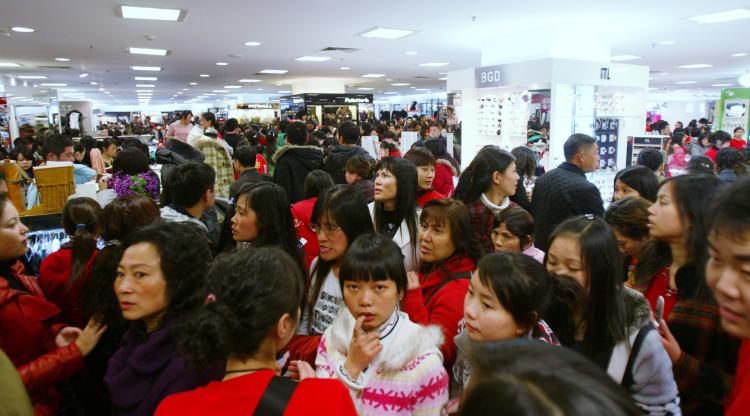 Customers shop in a crowded department store on November 29, 2008 in Chengdu of Sichcuan Province, China. (China Photos/Getty Images)