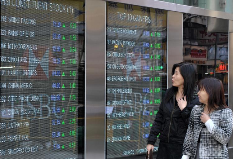 A board displaying stock prices on the Hang Seng Index in Hong Kong.  (Mike Clarke/AFP/Getty Images)