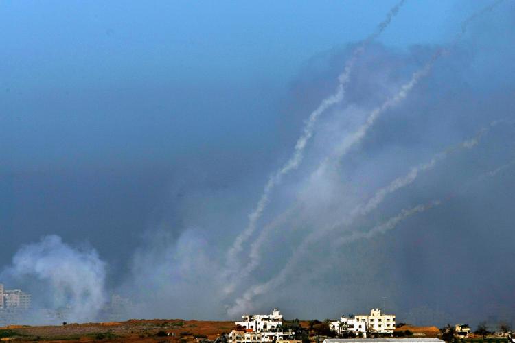 A barrage of four Palestinian Qassam rockets leave smoke trails in the sky as they are fired by Hamas militants on January 6, 2009 inside the Gaza Strip towards the Israeli town of Sderot, as seen from Israel's border with the Palestinian territory (David Silverman/Getty Images)