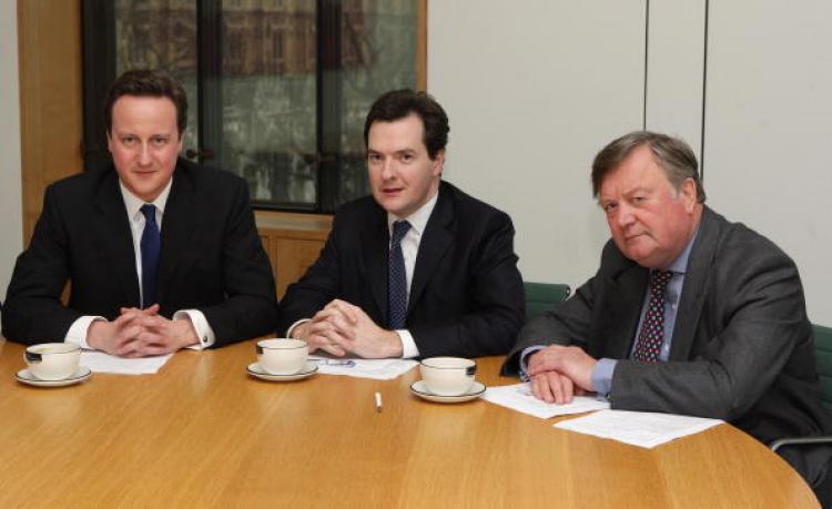 Cancellor George Osborne (centre) with Prime Minister David Cameron (left) who will follow 1990s Canadia  to claw the UK out of debt. Ken Clarke, Justice Secretary, who was a previous Chancellor, is on the right. (Oli Scarff/Getty Images)