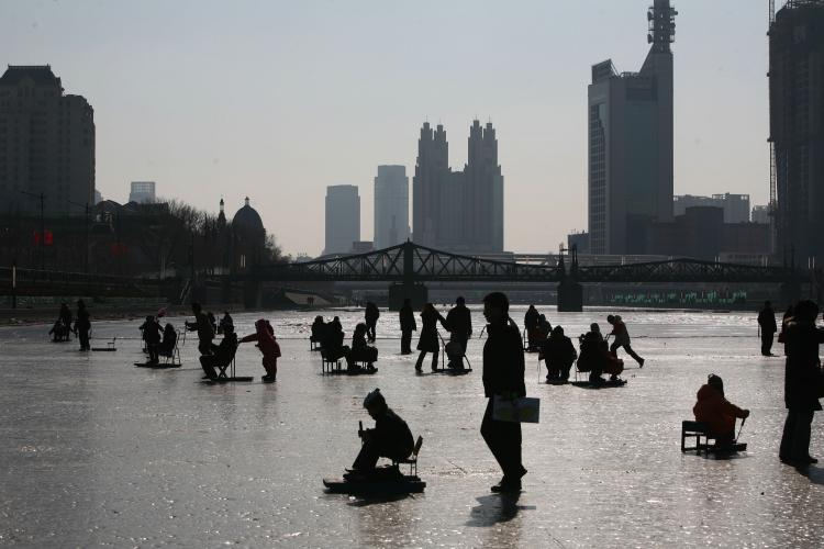 People on the frozen Haihe River on January 26, 2009 in Tianjin, China.  (China Photos/Getty Images)