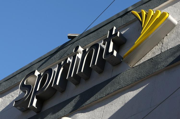 The Sprint logo is displayed on the front of a Sprint retail store in San Francisco, California.  (Justin Sullivan/Getty Images)