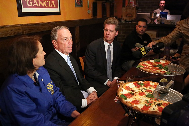  Mayor Michael Bloomberg (c) speaks to the press at Goodfella's Pizzeria on Staten Island, while Housing and Urban Development Secretary Shaun Donovan (R) and Small Business Administrator Karen Mills listen. (Photo courtesy the Mayors Office). 
