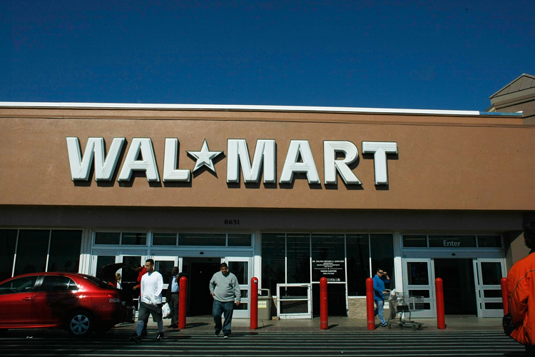 Customers exit a Walmart store in Miami