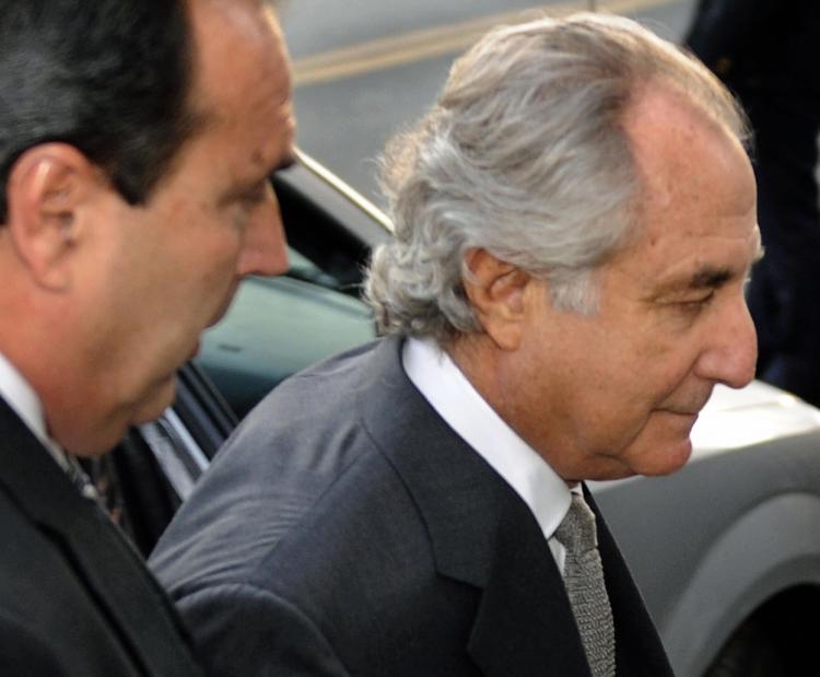Bernie Madoff, the biggest fraudster of them all, arrives at a US Federal Court in March 12 in New York. Economic crime in Canada rose to its highest in six years in 2009. (Timothy A. Clary/AFP/Getty Images)