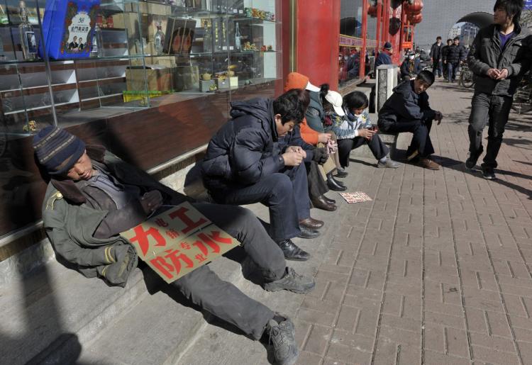 Migrant workers look for job opportunities along a roadside in Shenyang, Liaoning Province, China.  (China Photos/Getty Images)
