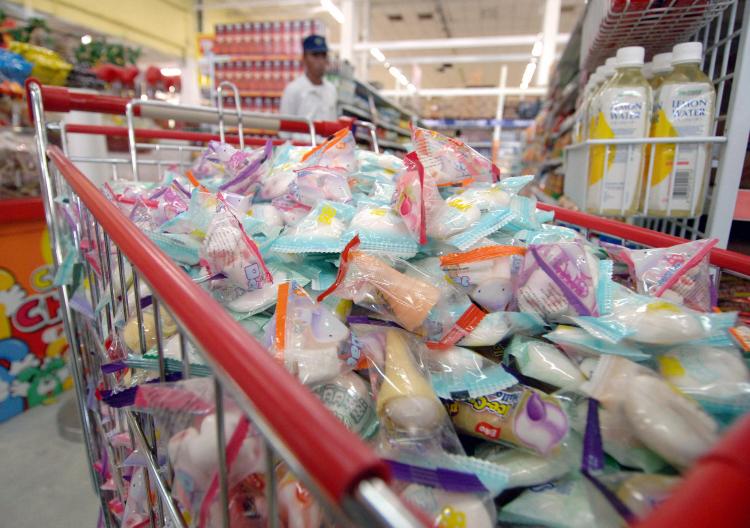 Imported candy, manufactured in China is taken off the shelves in a supermarket by Indonesia's Drugs and Food Agency, locally know as Badan Pengawasan Obat dan Makanan (BPOM) in Denpasar on March 13, 2009. (Sonny Tumbelaka/AFP/Getty Images)