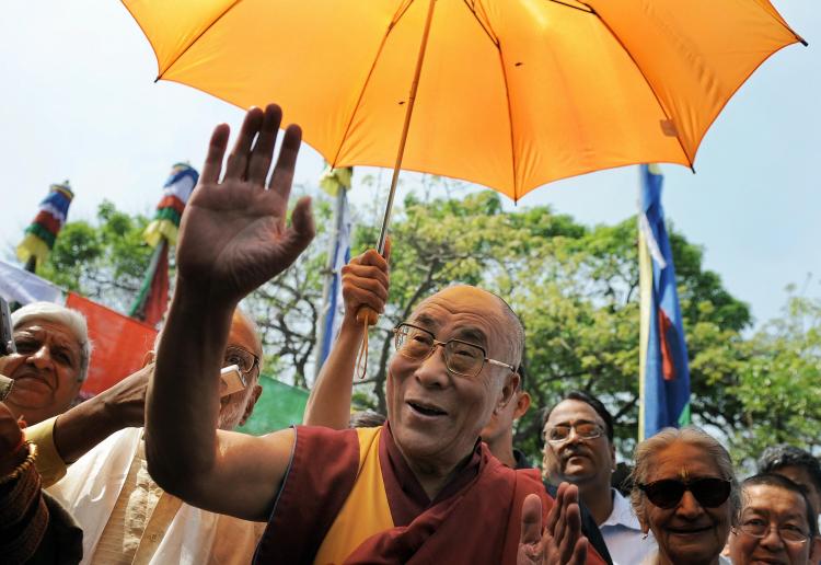 The 73-year-old exiled Tibetan spiritual leader, Dalai Lama gestures as he arrives to a attend a Tibetan Arts and Culture exhibition in New Delhi on March 30, 2009.  (Manan Vatsyayana/AFP/Getty Images)