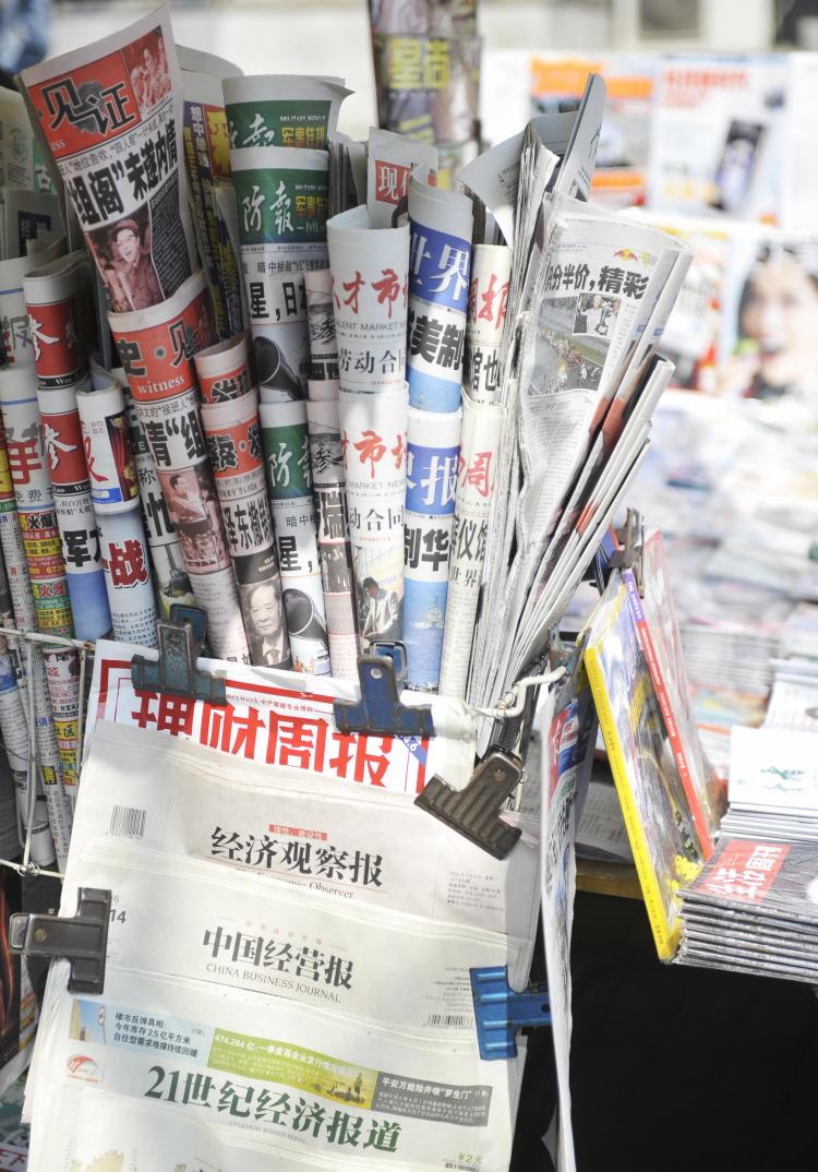 Various newspapers and magazines are seen at a roadside stall in Beijing on April 7, 2009. (EMILIE MOCELLIN/AFP/Getty Images)