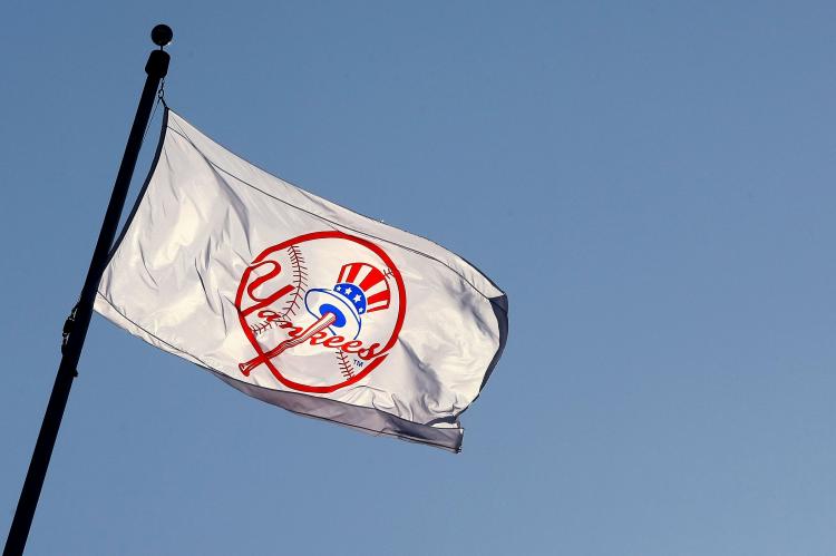 A Yankee flag waves over new New York Yankees stadium. (Chris McGrath/Getty Images)