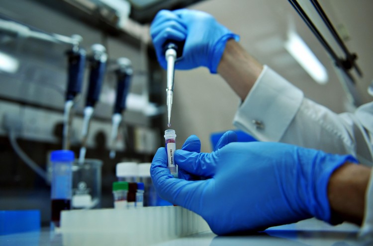 A technician working on a DNA test at a company laboratory in Southampton on May 2, 2009, shown in this file photo. (Leon Neal/AFP/Getty Images)