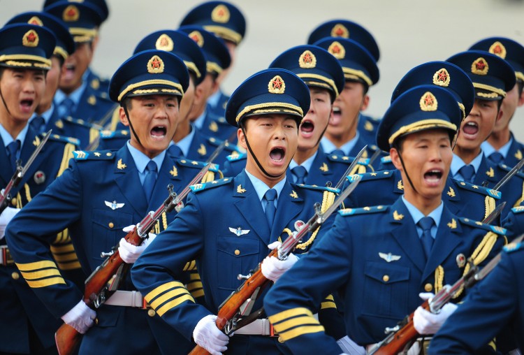 Chinese navy guards yell as they march in Beijing in 2009. The military question in the context of Bo Xilai's political drama remains inconclusive. (Frederic J. Brown/AFP/Getty Images) 