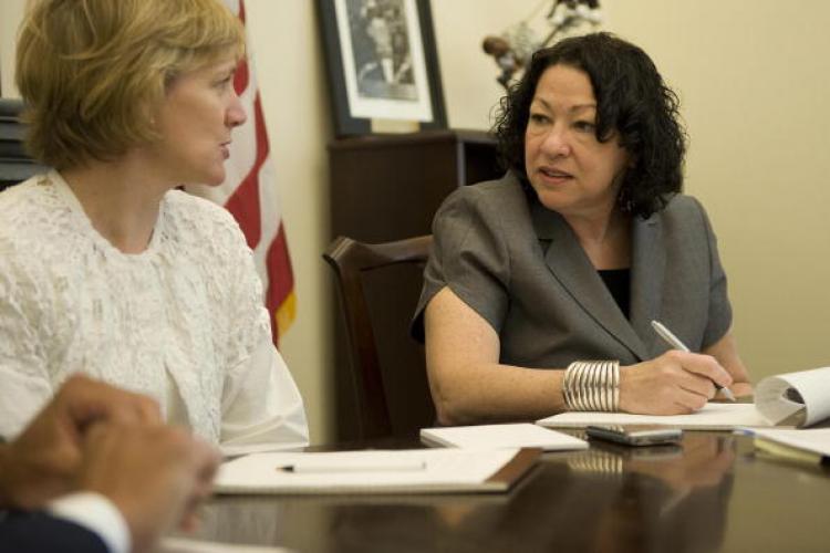 President Obama's nomination for Supreme Court justice Judge Sonia Sotomayor (R) meets with members of the White House Counsel's Office at the Eisenhower Executive Office Building in Washington, DC, on Monday. (Jim Watson/AFP/Getty Images)