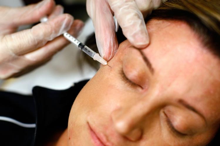 Lyn Talent receives a free Botox injection during the 'The Botox Bailout' where the first 50 recently laid-off workers could exchange their resumes for free Botox injections in Virginia. (Win McNamee/Getty Images)