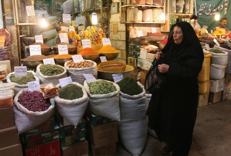 An Iranian woman shops at a bazaar 
