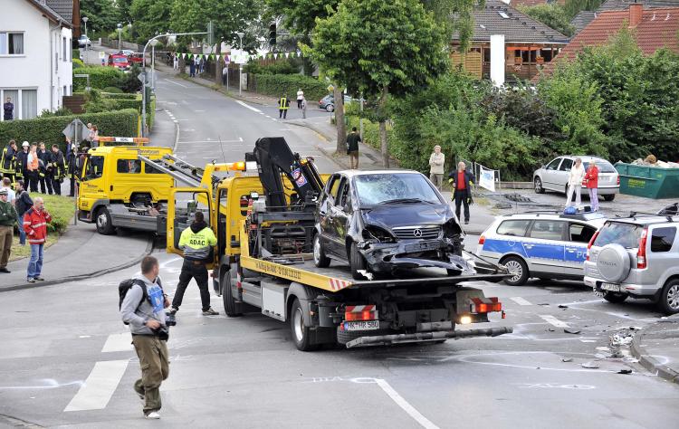 Accident damaged cars are recovered on July 19, 2009 in Menden near Arnsberg, Germany. (Kirsten Neumann/Getty Images)