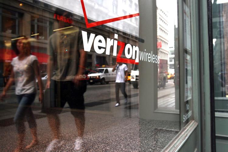 A Verizon  Wireless store that people are walking past in New York City. Verizon Wireless said it would pay as much as $90 million to cell phone customers who were wrongly charged for Internet use.  (Spencer Platt/Getty Images)