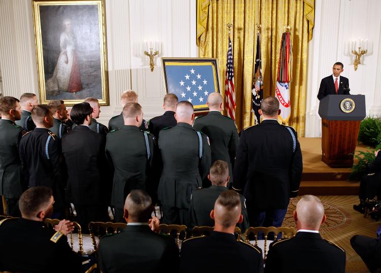 U.S. President Barack Obama (R) awards Sergeant First Class Jared C. Monti's posthumous Medal of Honor on September 17, 2009. Sgt. Monti was killed in 2006 in Afghanistan while attempting to rescue a fellow soldier. (Chip Somodevilla/Getty Images)