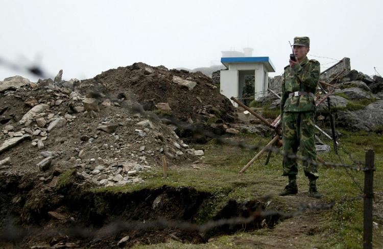 INDO-TIBETAN PATROL: Chinese soldier patrolling the Sikkim border.India and China reached an agreement in 1996 in which both sides pledged not to open fire for any reason. (Photo taken on July 10, 2008.) (DIPTENDU DUTTA/AFP/Getty Images)