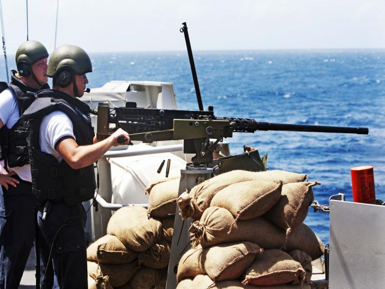 Crewmembers of the Dutch frigate Hr. Ms. Evertsen look on during a military exercice on September 21, 2009. The Dutch frigate HMS Evertsen takes part in the Operation Atalanta, a campaign from the European Union to stop piracy off the Somali Coast. The joint naval patrol will include vessels from Belgium, Britain, France, Germany, Italy, Greece, the Netherlands, Spain and Sweden. (Robin Utrecht/AFP/Getty Images)