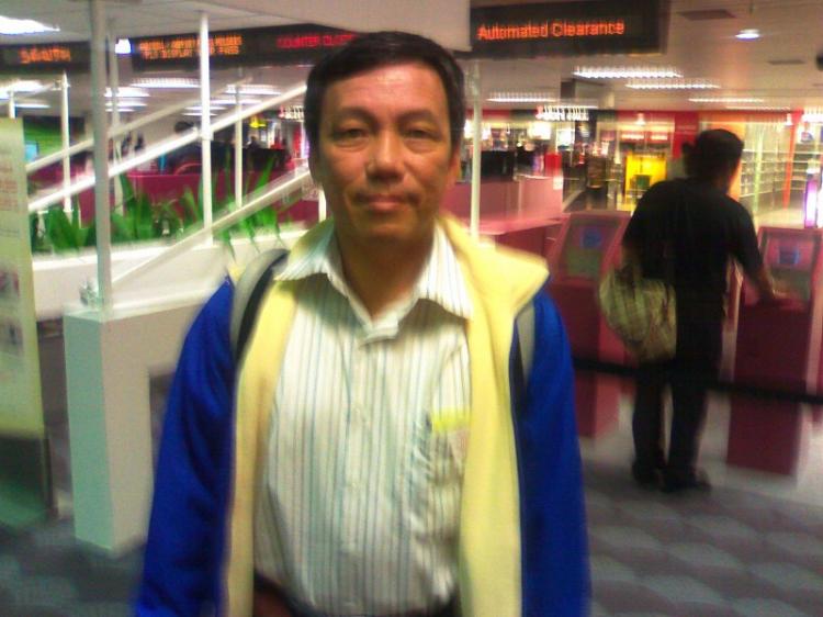 Liman, from Indonesia, stands at the airport in a photo taken with his cell phone. He was turned away by officials at the Singapore airport who did not explain why. (Courtesy of subject)
