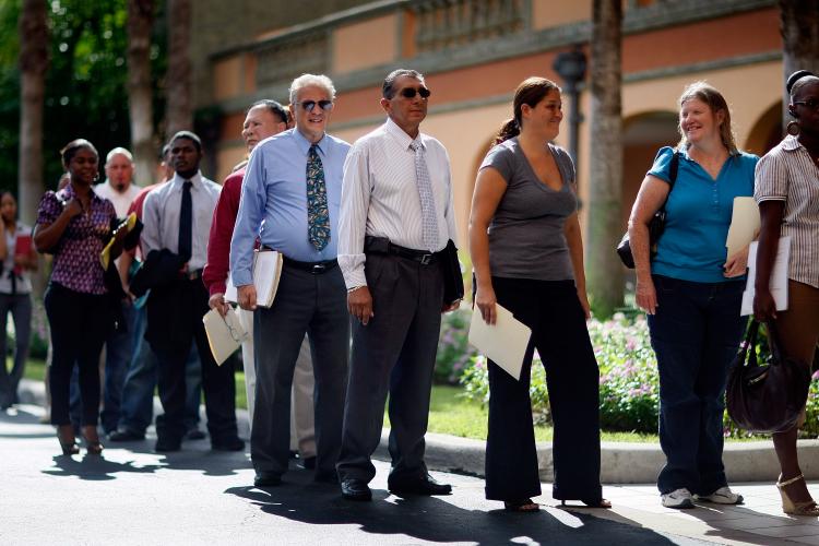 People stand in line at a job fair on September 24, 2009. (Joe Raedle/Getty Images)