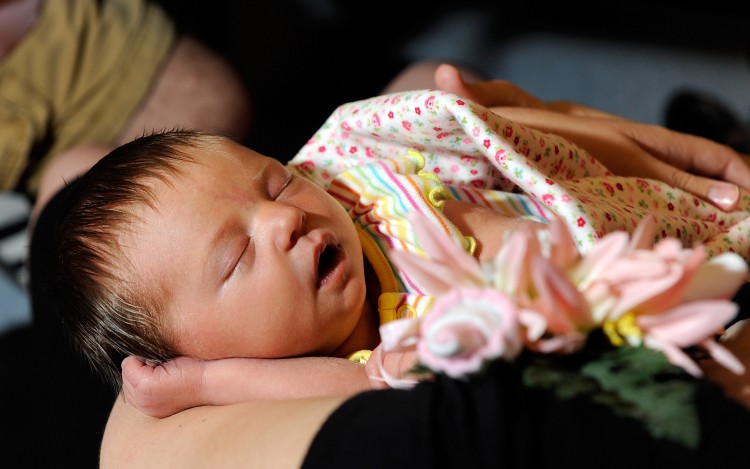 PRECIOUS: A new health initiative by HHS is offering support for breast-feeding equipment, contraception, and HIV screening for women. Seven-day-old Coral Allen is shown above during a baby shower in 2009, Las Vegas, Nevada.