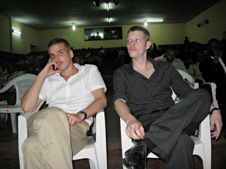 Norwegian defendants Joshua French (R) and Tjostolv Moland (L) sit in court as they listen during a military tribunal in the northern Democratic Republic of Congo that rejected an appeal to their death sentence in Kisangani on Dec. 3, 2009. The pair, both (Stringer/AFP/Getty Images)