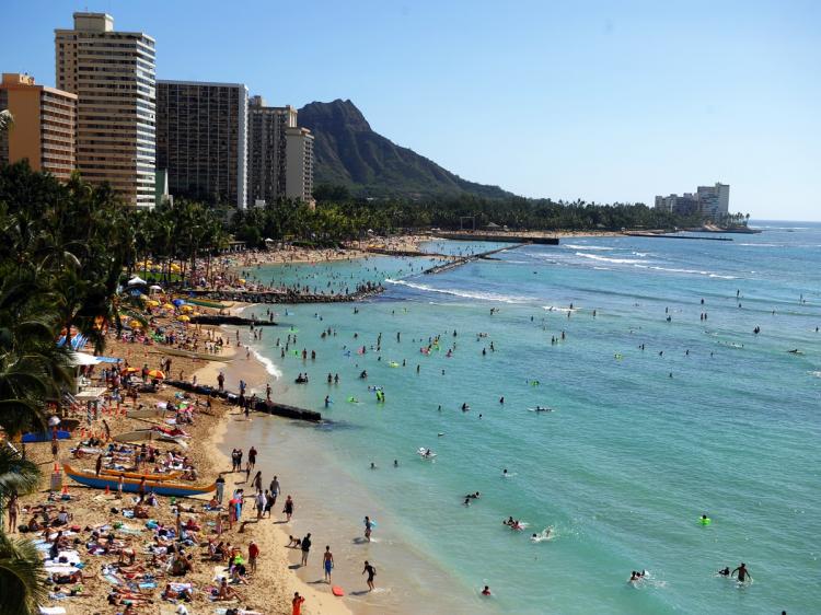 Waikiki beach in Honolulu, Hawaii, on Jan. 1, 2010. Waikiki, which is a popular tourist destination, was a retreat for Hawaiian royalty in the 1800s. Much like the locals and tourists of today, Hawaiian royalty enjoyed surfing at Waikiki on early forms of long boards. (Jewel Samad/AFP/Getty Images)