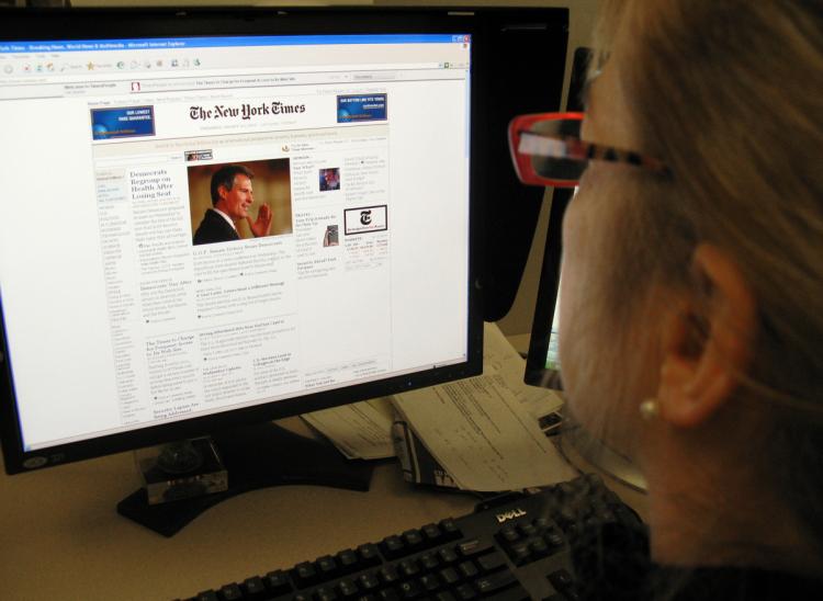 When the New York Times started to charge for online news content, overall website visits decreased by up to 15 percent. A new study says 81 percent of Canadians would not pay to read news online. (Karen Bleier/Getty images)