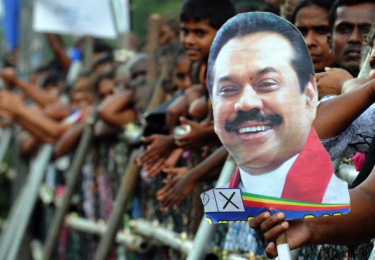 Supporters of Sri Lankan President Mahinda Rajapaksa cheer him in Colombo on Jan. 27 after he was declared duly elected by the Elections Commissioner. Rajapaksa won a second term, defeating Sarath Fonseka with 57.9 percent of the popular vote. (Lakruwan Wanniarachchi/AFP/Getty Images)