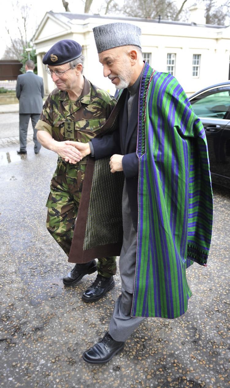 Afghan President Hamid Karzai (right) meets U.K. Chief of the General Staff General Sir David Richards (left) at Wellington Barracks in London, England on January 28.  (Tim Ireland/Getty )